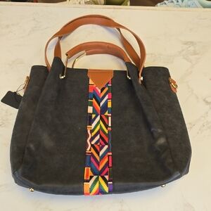 Elegant Black Tote Bag with Brown Handles and Colorful Pattern